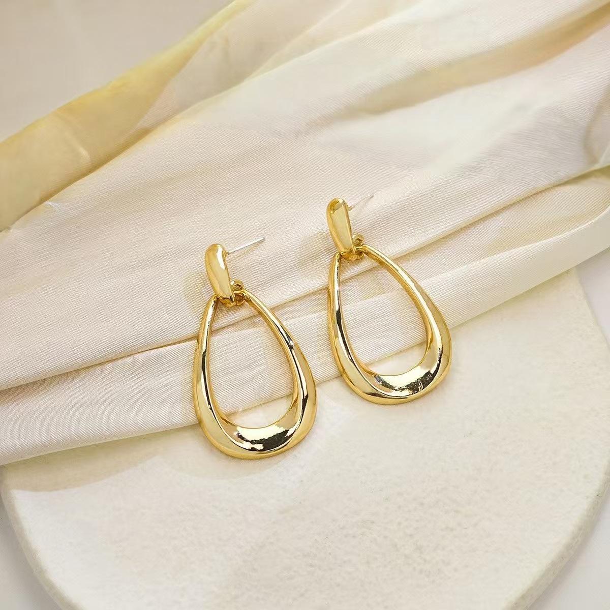 Geometric Water Drop Earrings: Elegant  Versatile Light Luxury Studs for Women 22K