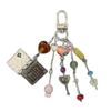Playful Rotating Page Keyring Beaded Accent Lightweight Design Phone Case Pendant For Stationery Enthusiasts
