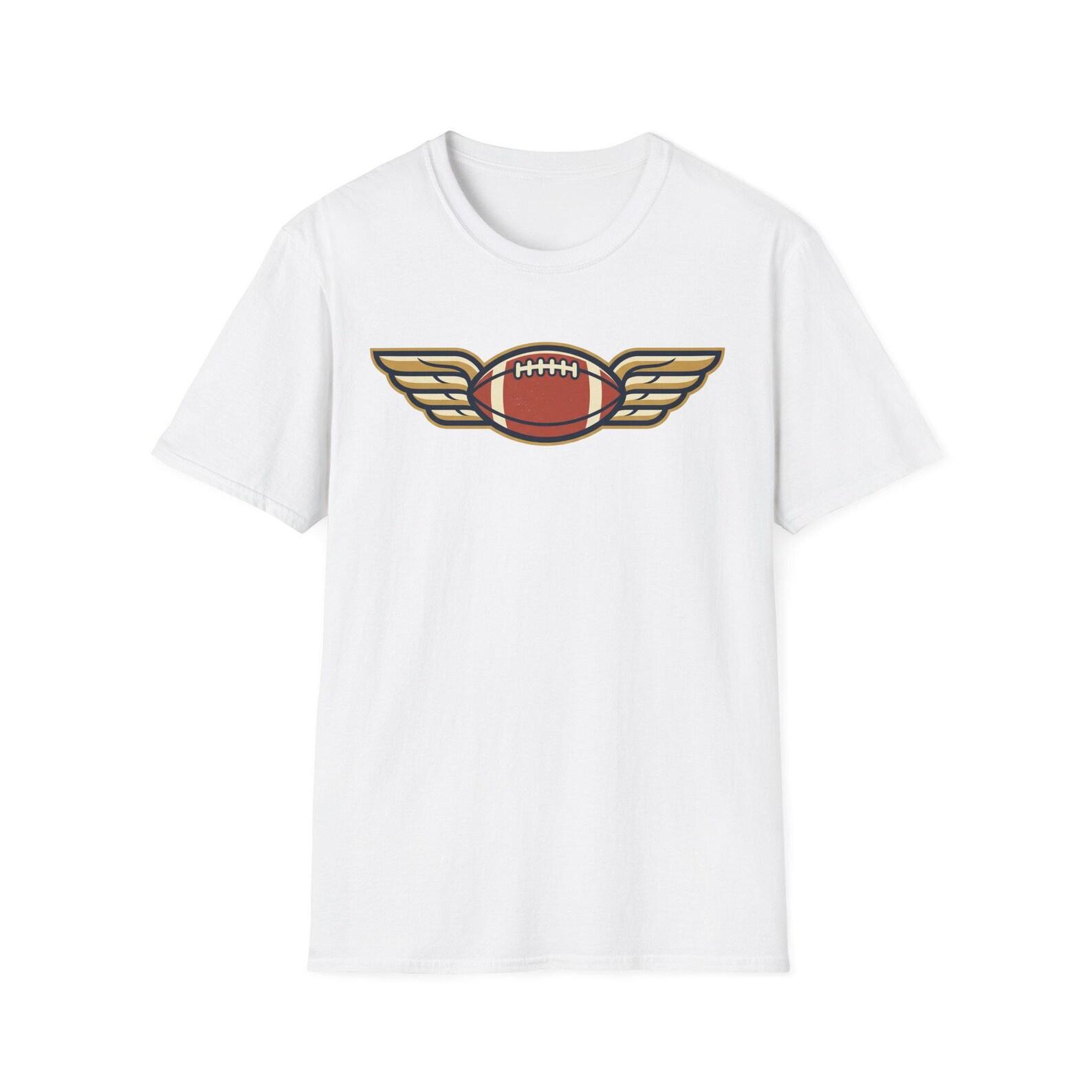 Winged Football Graphic Tee | Vintage Flying Football Shirt | Game Day Fan Gift | Unisex Sports Tee S