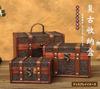 Antique-style wooden box with embossed details and retro rivet decoration for small items