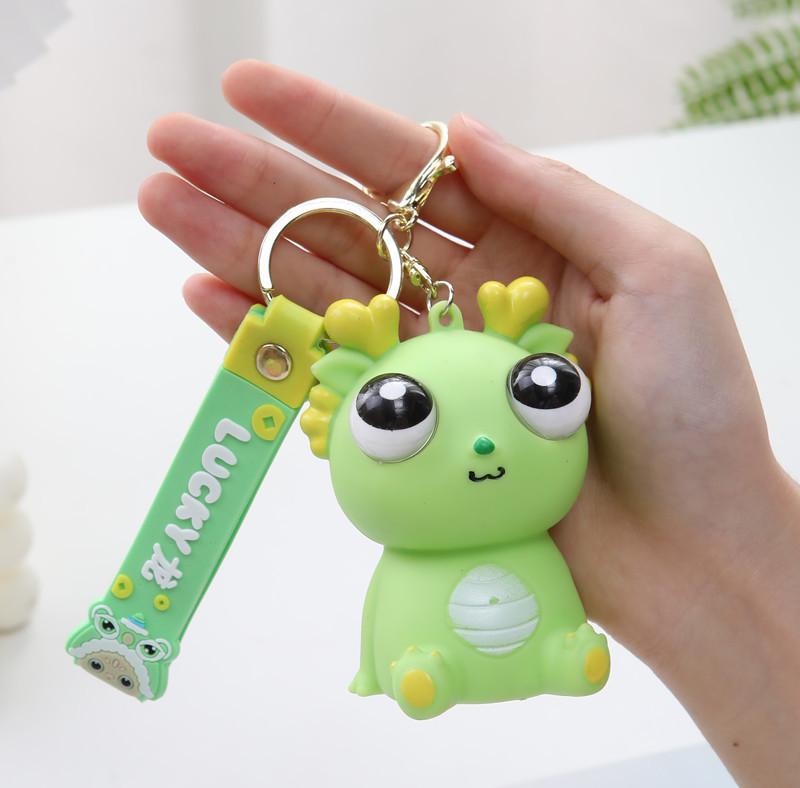 Exploding Eye Dragon Keychain: Squishy Stress Relief Toy and Pendant