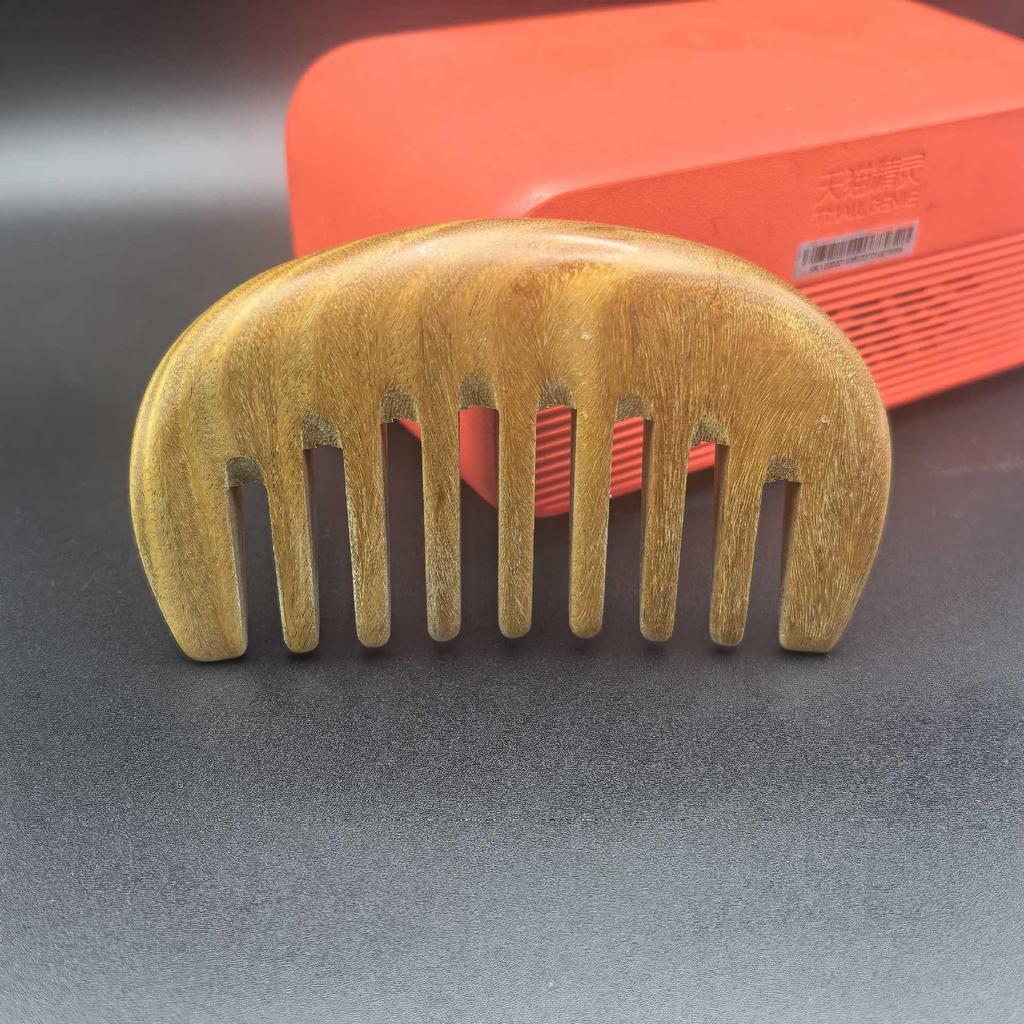 One Piece Gold Sandalwood Five-Tooth Massage Comb for Head and Meridian Stimulation.