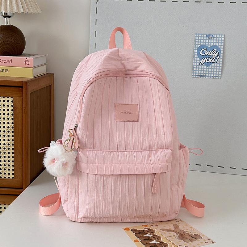 School bag junior high school girls large capacity solid color light primary school backpack high value girl versatile backpack