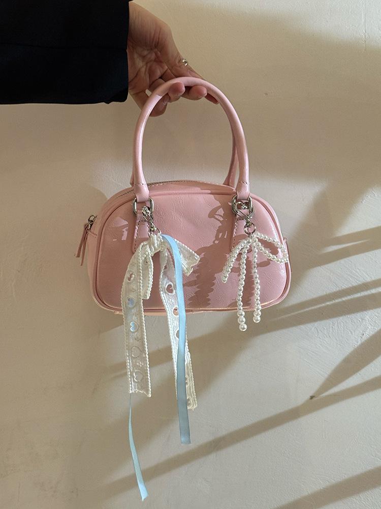 

Korean niche design portable Boston bag women s new high-end sense daily commuting versatile shoulder messenger bag