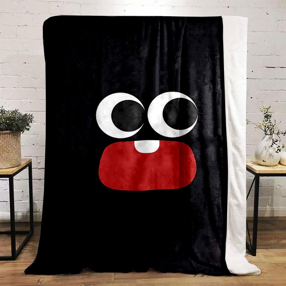 Large cartoon eyes and a red mouth with one tooth on a black background. for all seasons blanket lunch break throw gift