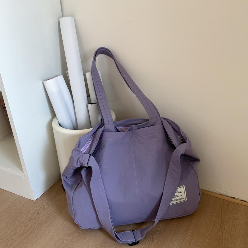 

Canvas bag women s large-capacity new summer versatile simple messenger bag casual college student tote bag фіолетовий