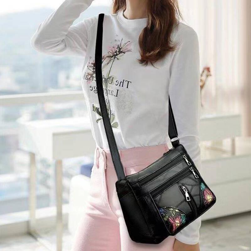 The lady's crossbody bag is made of PU and features printed patterns, perfect for traveling and shopping.
