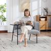 Modern single armchair with comfortable fabric backrest and two storage compartments, complemented by a practical side table.