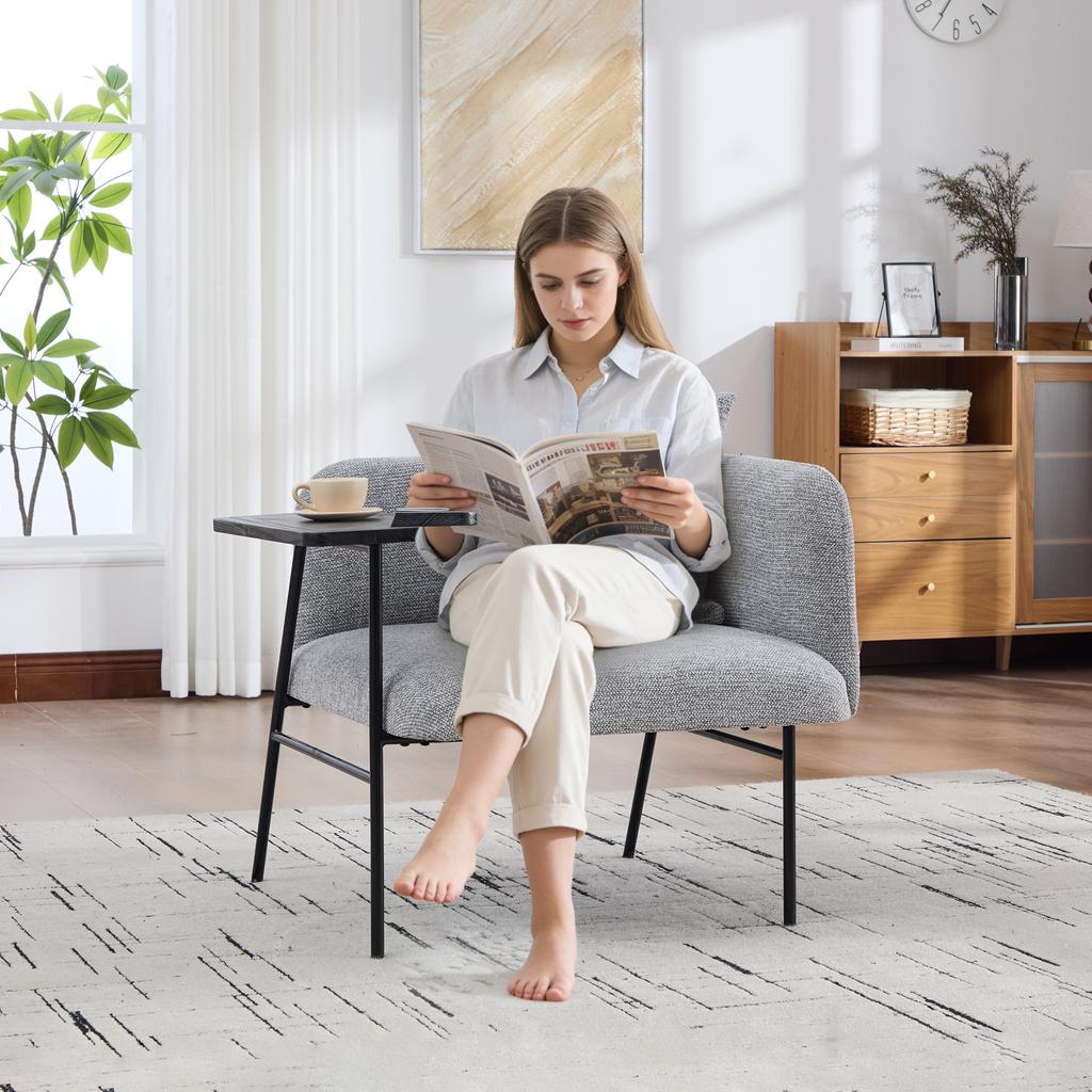 Modern single armchair with comfortable fabric backrest and two storage compartments, complemented by a practical side table.