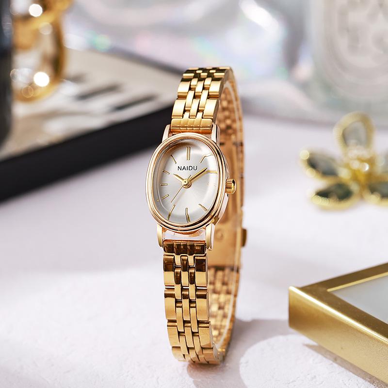 

Жіночий розкішний кварцовий годинник NAIDU з овальним циферблатом і сталевим браслетом з мітками у вигляді паличок