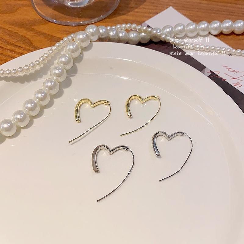 Luksusowe kolczyki serca z igłą ze srebra S925 - Modny, uniwersalny design dla kobiet