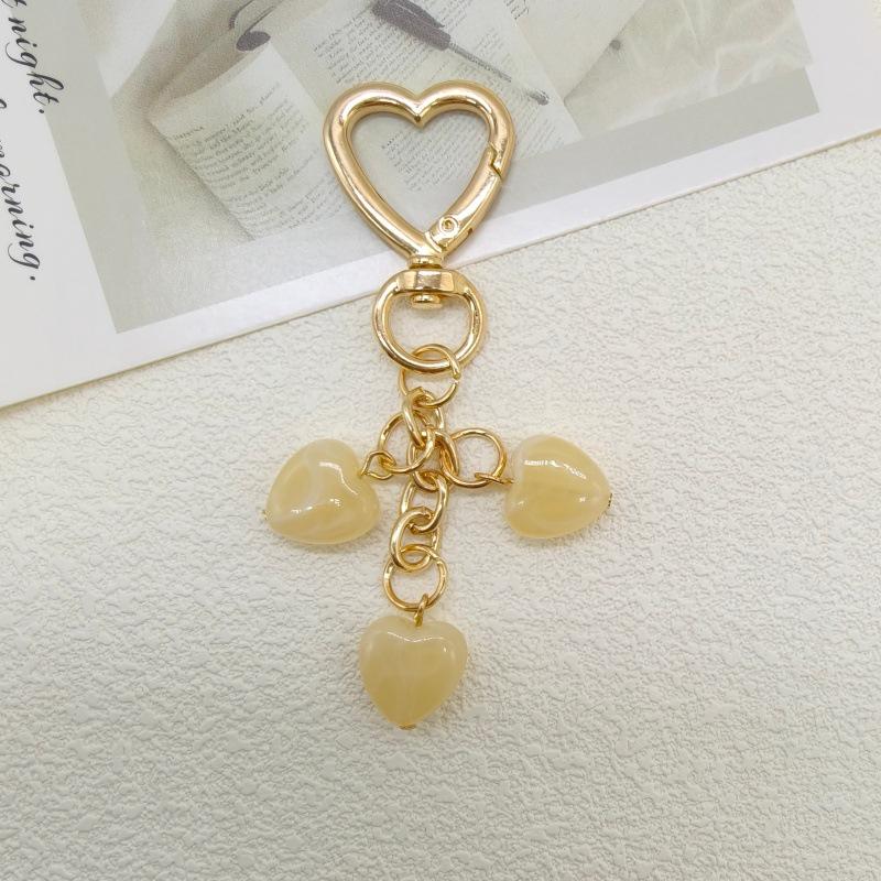 Koreańska Moda Breloczek z Serduszkiem i Smyczka do Telefonu z Zawieszką z Koralików