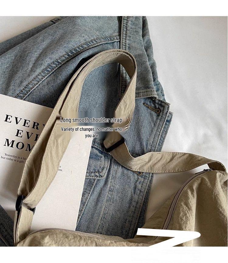 Japanese-Style Waterproof Nylon Dumpling Crossbody Bag: Sporty, Large-Capacity Tote for Men & Women, Ideal for Cycling & Relaxed Shoulder Wear.