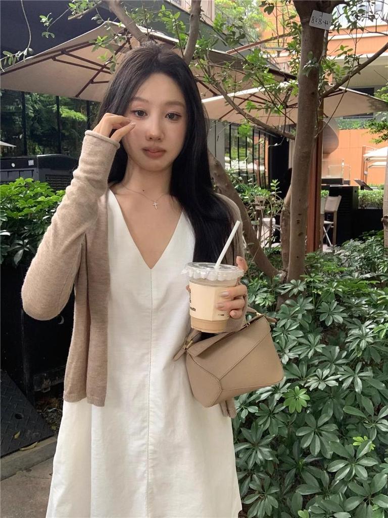 Women's Stylish V-Neck Sleeveless Summer Dress: Loose Fit, Slimming, Solid Color, Short Skirt - New Fashion Collection.