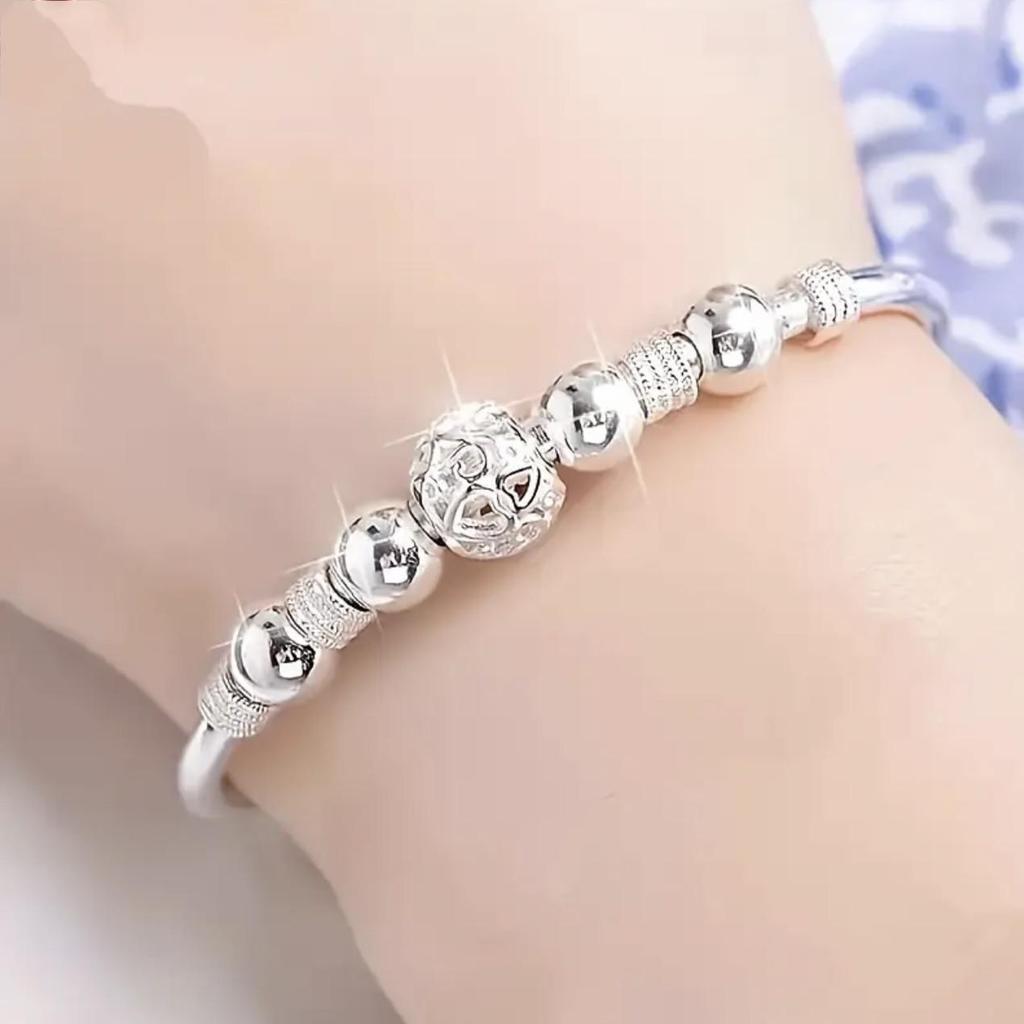 European-Style Silver-Plated Rotating Bead Bracelet for Women: Hollow Exquisite Ball Ornament Jewelry