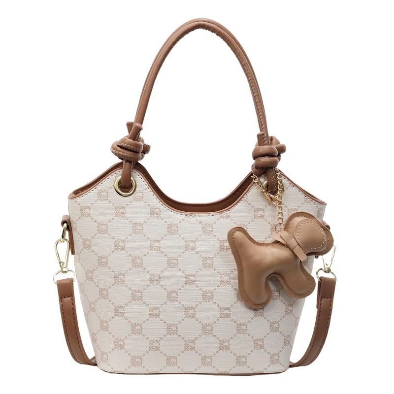 Korean version of trend, high-end printing temperament, portable bucket bag, niche fashion commuting versatile light luxury messenger bag, women