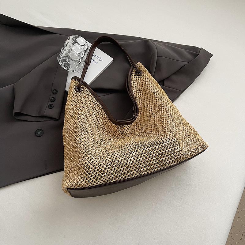 Seaside vacation bag women's new woven tote bag large capacity casual versatile shoulder armpit bag
