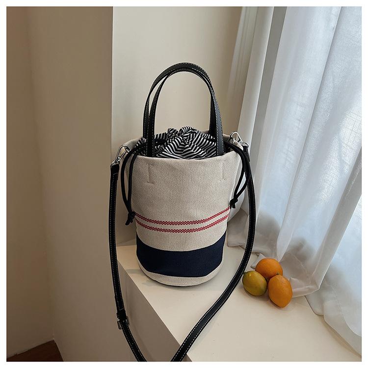 

2025 summer new striped beach bag women s bag simple fashion casual portable shoulder bag premium sense bucket bag