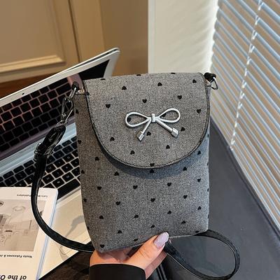 Eine Nischen-Design-Punkt-Kreuzbody-Tasche mit Schleife, Eine modische kleine Kreuzbody-Tasche und Eine einfache Handytasche für den Weg zur Arbeit