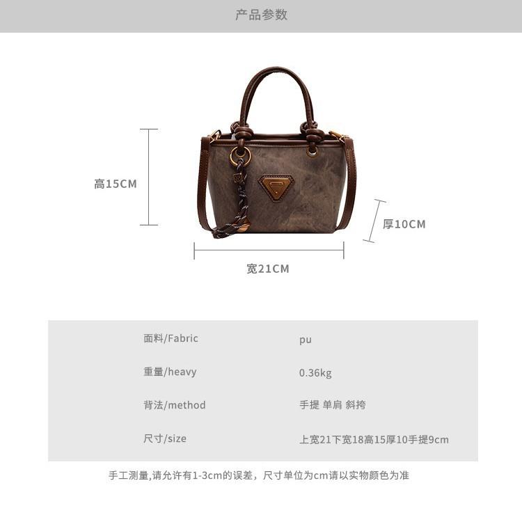 Spring new simple retro hand bucket bag women's shoulder bag high-end texture niche messenger bag