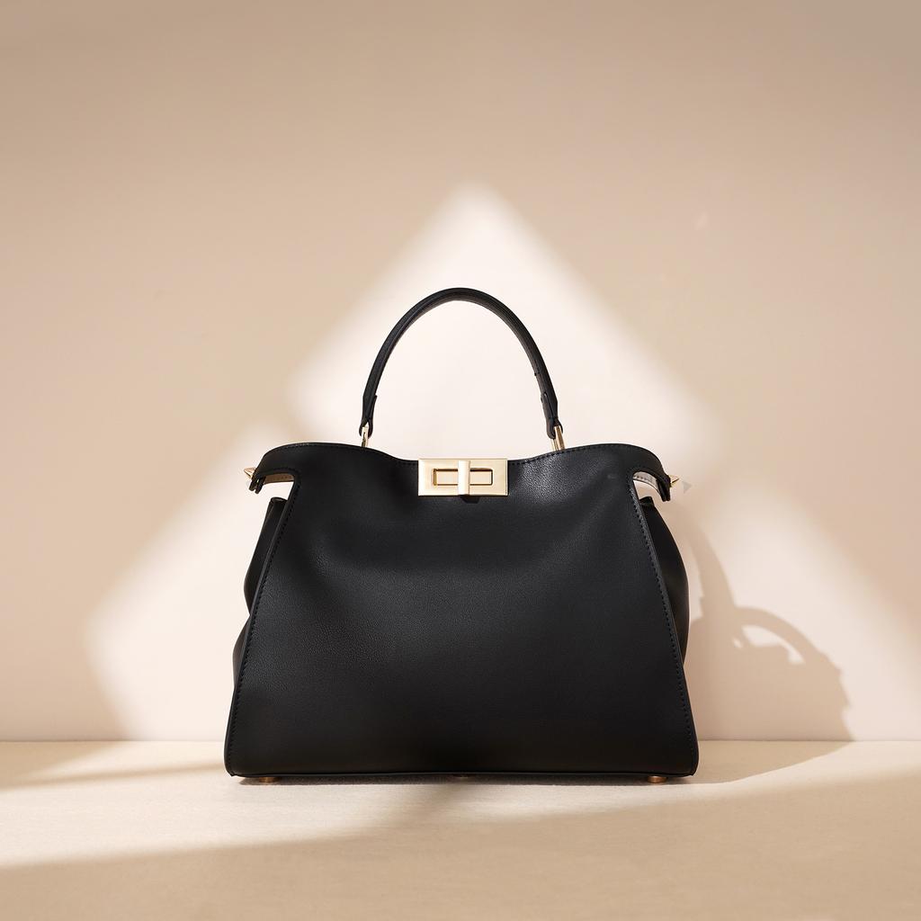 Nova bolsa real de 2025, bolsa feminina de couro genuíno, fivela giratória, bolsa mensageiro feminina grande de couro de vaca, bolsa mensageiro portátil, bolsa de mão.