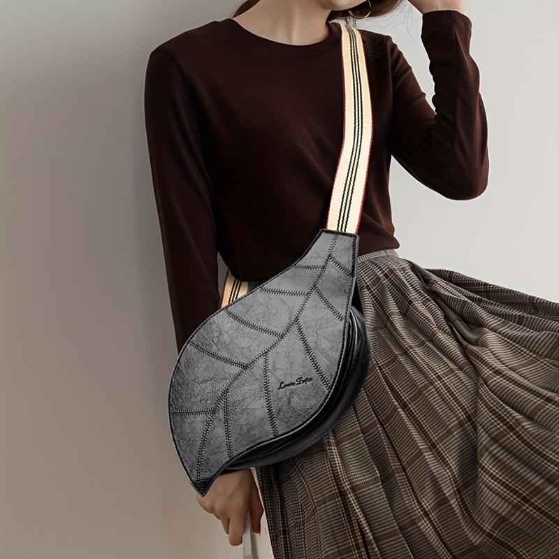 Versatile And Stylish Women'S Bag, Perfect for Vacations, Featuring a Unique Shape And Colorful Straps, Designed for Crossbody Or Shoulder Wear.