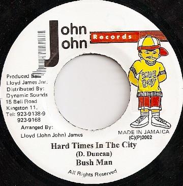 

7-дюймовая пластинка BUSHMAN - Hard Times In The City НИКАКОЙ John John Recor 2002 Ямайка Регги, Ска и Даб Б/У