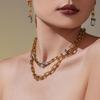 Qiong Yao U-förmiges vergoldetes Edelstahl-Schmuckset: Zirkonia Ohrringe, Halskette & Armband.