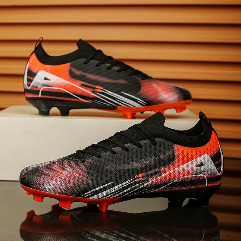 Amazon Xiyin seamless fly-woven football shoes low-top spikes artificial turf sports student men's training shoes