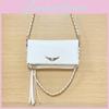 Simple Solid Color Gold Wing Decoration Women Shoulder Bag With Tassels For Casual Wear