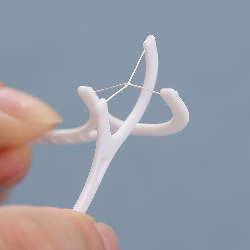 50 szt. Nić dentystyczna Flosser Picks Wykałaczki Patyczki do zębów Czyszczenie zębów Szczoteczka międzyzębowa Wykałaczka z nicią dentystyczną Pielęgnacja higieny jamy ustnej