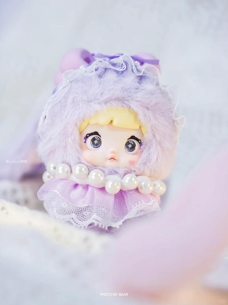 Nommi Plush Mascot Keychain Blind Box Fluffy Exterior Rigid Interior for Standing Includes 3 Rotating Perfect as a Bag Charm or Tabletop Decor 8 Types