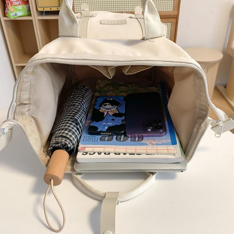 Stylish Mommy Bag: Hand-held Baby & Mother Backpack for Light Travel