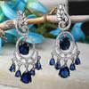 Rhodium-Plated American Diamond Studded Oval & Leaf Shaped Drop Earrings For Girls and Women