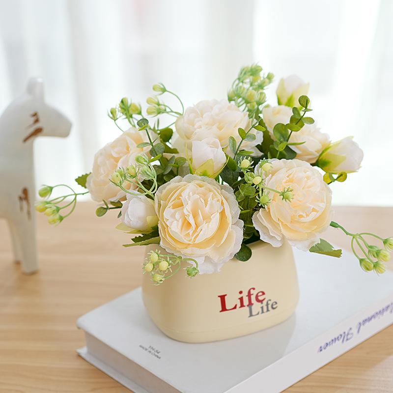 Living Room Decor: Artificial Sunflower and Green Plant Arrangements, Small Potted Plants, and Plastic Bouquets
