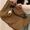 Tote Bag with Large Capacity and Multiple Pockets, for Commuting, with A Single Shoulder Strap and A Slanted Design.