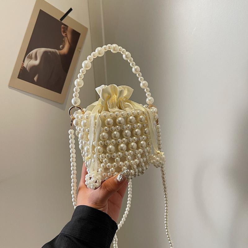 Premium bag 2025 spring new fashion woven pearl bucket handbag crossbody hollow bag
