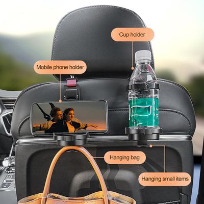 Trīs vienā glāzes turētājs Mobilā tālruņa turētāja somas āķis automašīnas sēdeklī. Daudzfunkcionāla sēdekļa atzveltne Organizators Glabāšana Auto galvas balsta fiksators