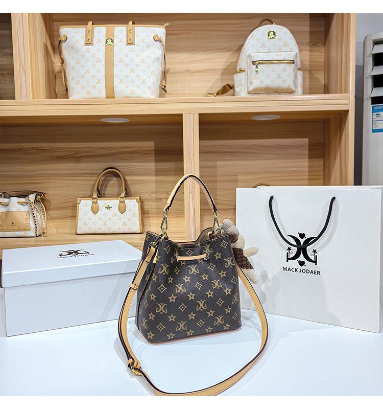 Women's Large Capacity Single Shoulder Bucket Bag with Inner Lining, Compartment Organizer, and Zippered Middle Section.