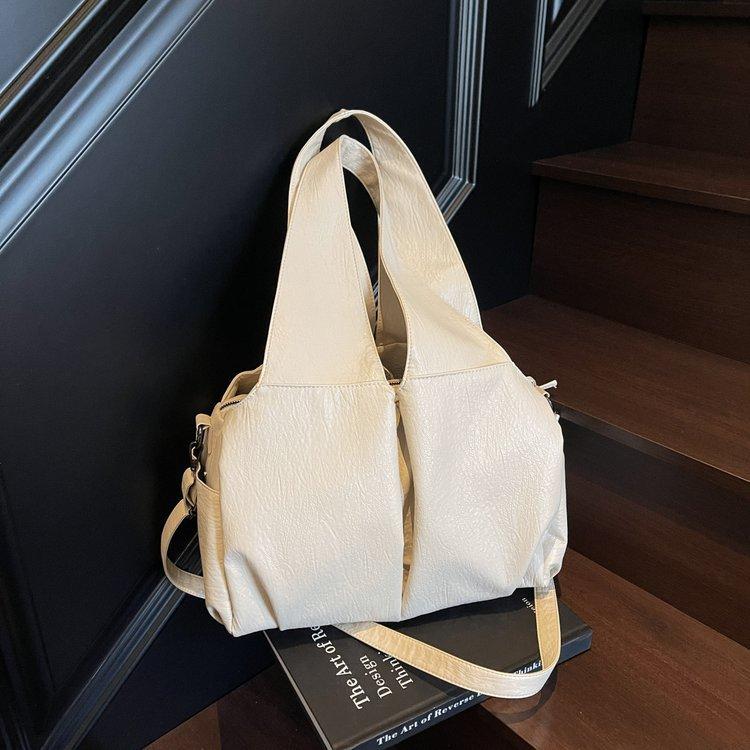

This year, large-capacity satchel women s 2025 new fashionable simple retro solid color commuter niche shoulder bag is popular. белый