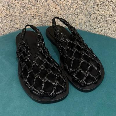 Version cuir de vache~ niche filet de pêche tissé à fond plat creux sandales romaines pour femmes 2025 nouvel été nouvelles pantoufles cool
