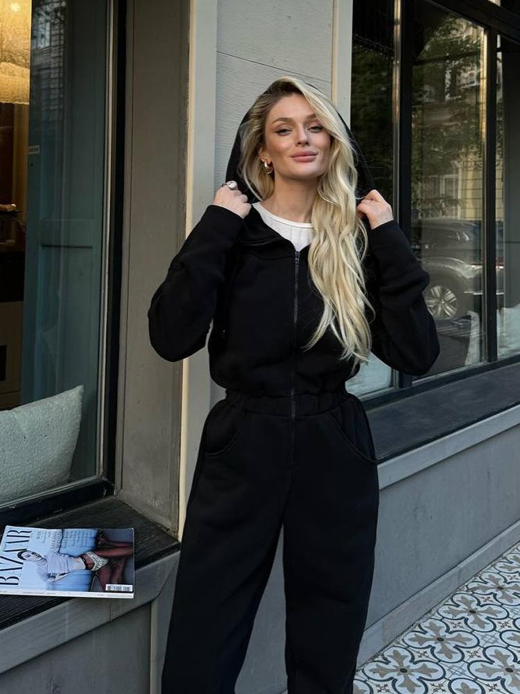 Tuta intera da donna casual europea e americana con cappuccio in vita a tinta unita a maniche lunghe con cerniera sportiva intera