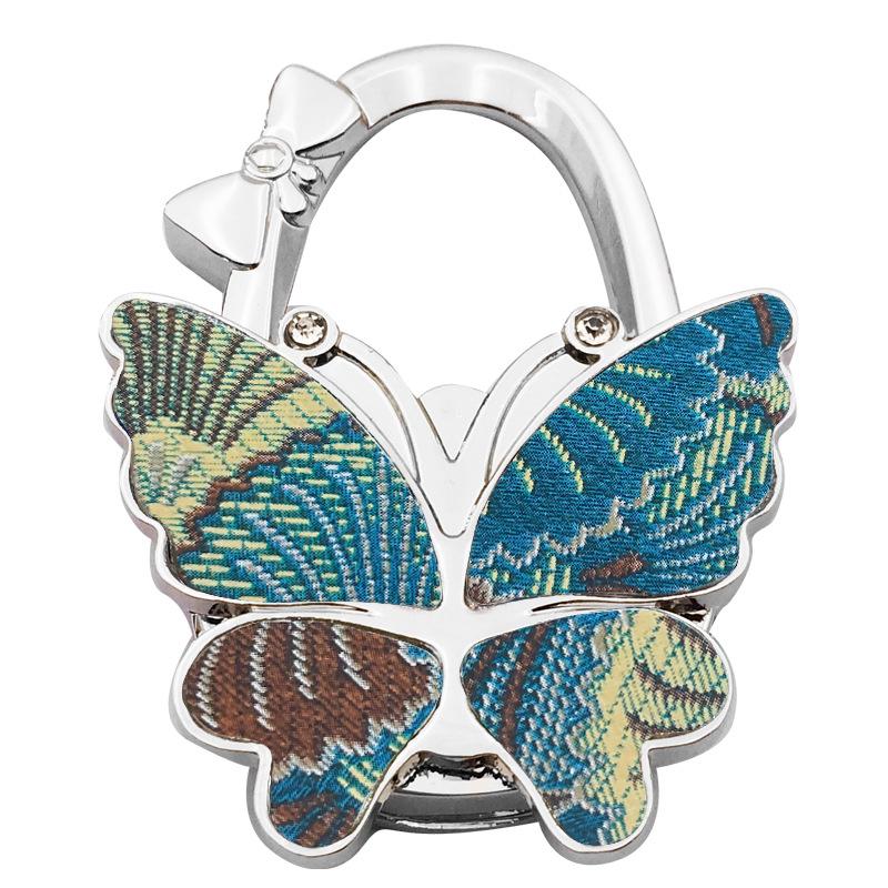 Large Matte Butterfly Hanging Bag Hook - Foldable Women's Bag Buckle & Portable Table Edge Hook for Luggage Accessories.