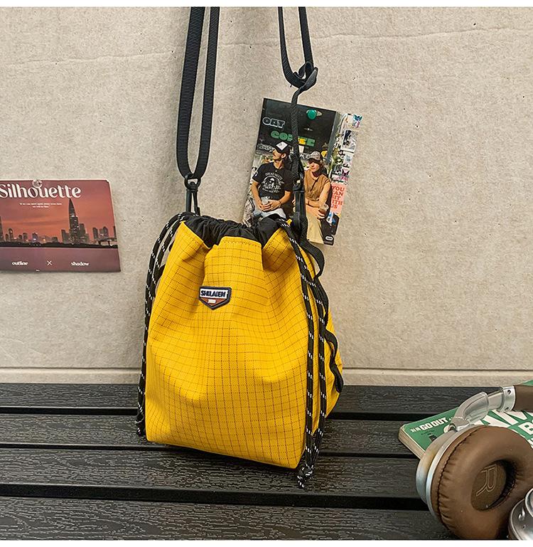 Tide brand messenger bag, men's and women's outdoor sports, girls' drawstring, bundle, color matching, one-shoulder small bucket backpack.