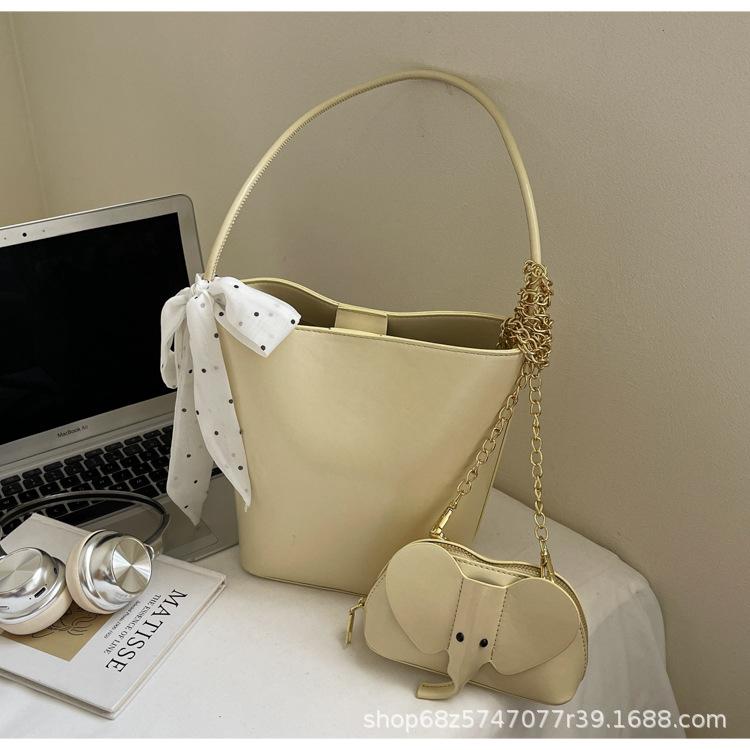 

2-piece small bag women s 2025 new bucket bag summer niche portable shoulder bag baby elephant chain messenger bag жовтий
