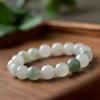 Women's Natural Tianshan Green Jade Bracelet with Round Beads and Floating Flower Design