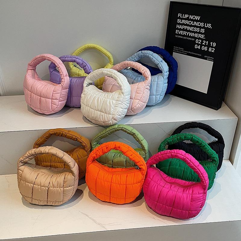 Niche fashionable pleated cloud bag women's solid color personalized hand carry cotton clothing bag