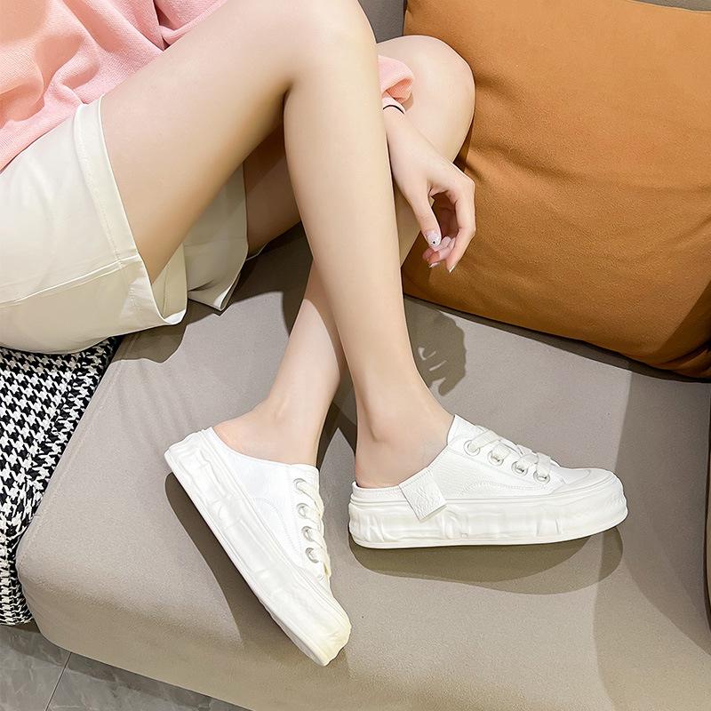 Leather bag head half slippers women's 2025 summer new biscuit sole dissolving half tray shoes without heel and one pedal white shoes