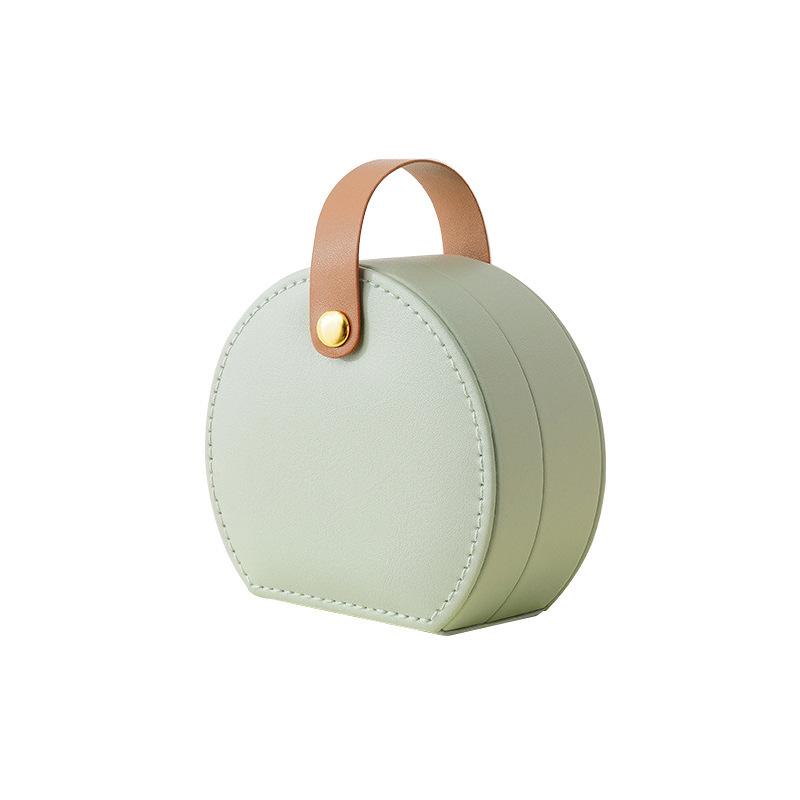 

Портативна ручна коробка для зберігання намиста та ювелірних виробів у формі півкола світло-зелений колір