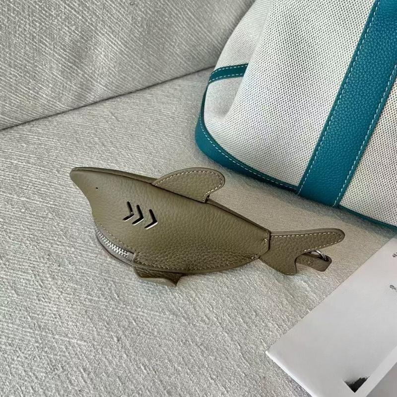 New leather dolphin change bag, keychain pendant, cute fashion earphones, lipstick storage bag.